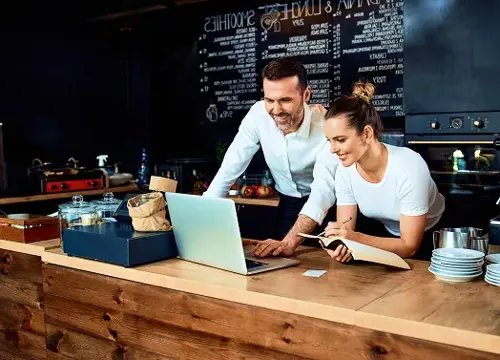Small business owner comparing energy deals.